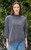 Woman wearing Country Laine - Slant Jumper (CL0115-IND2026) in the colour Dark Grey.