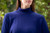 Woman wearing Country Laine - High Neck Sway Jumper (CL0122-IND2026) in the colour Atlantic.