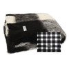 Folded Alpaca fleece throw in Friesian colour with pattern block.