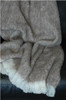 Alpaca fleece throw in Pumice colour draped on couch.