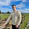 Man wearing Lesley Unisex Aran Wool sweater in the colour Cream.