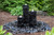 Three basalt columns from the Tranquil Decor Ebony Basalt Fountain water feature.