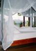 Canopy bed curtains tied back