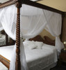 Canopy bed curtain on poster bed