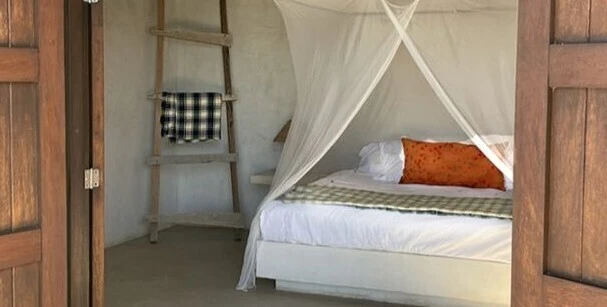 Sheer queen box bed canopy at Creando Olas, La Saladita, Mexico