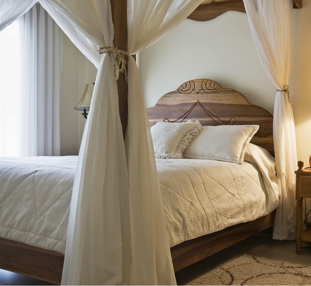Queen bed curtains draped on a queen size bed
