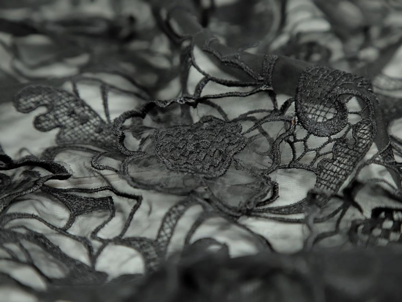 Handmade Floral Black Applique on Transparent Fabric. Stock Photo