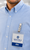 Commercial lifestyle image featuring two-hole metal badge clips, clear vinyl straps, and vertical badge holders worn by professionals, emphasizing a strong metal clip and dependable ID badge retention.