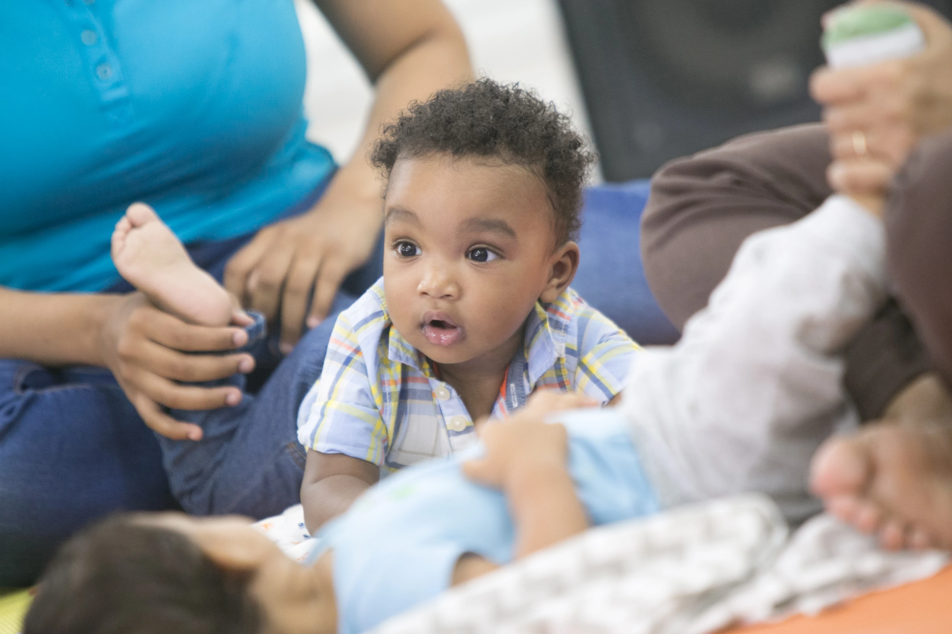 Parent using music with baby during everyday feeding and routines
