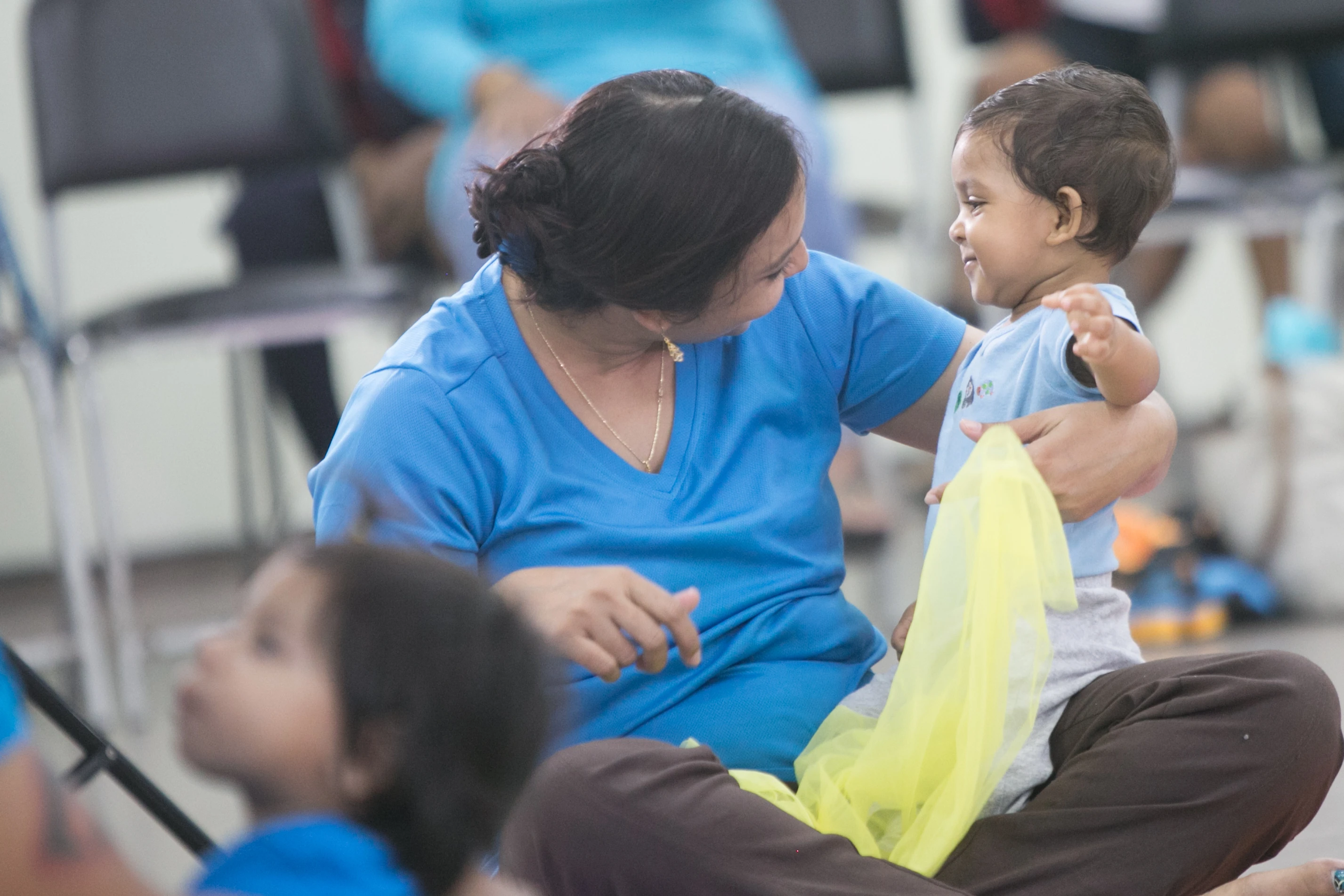 Baby engaged in sensory musical play at Alabanza MusicVersity
