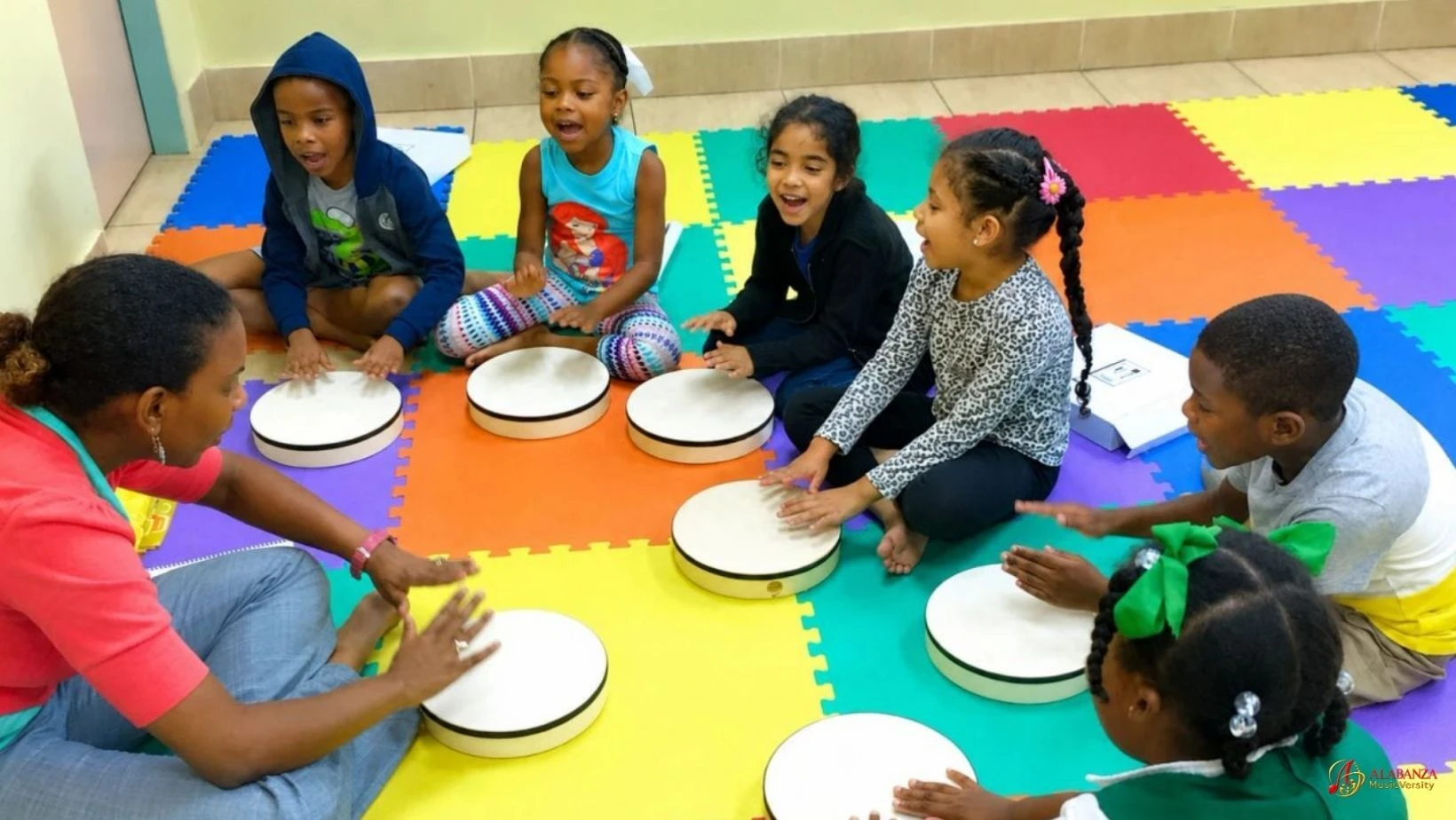 Alabanza MusicVersity children playing drums together in class