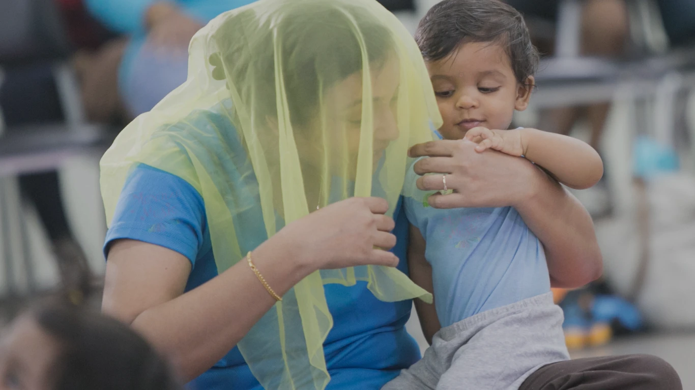 Baby playing with a scarf during a Bouncing Bambinos music class