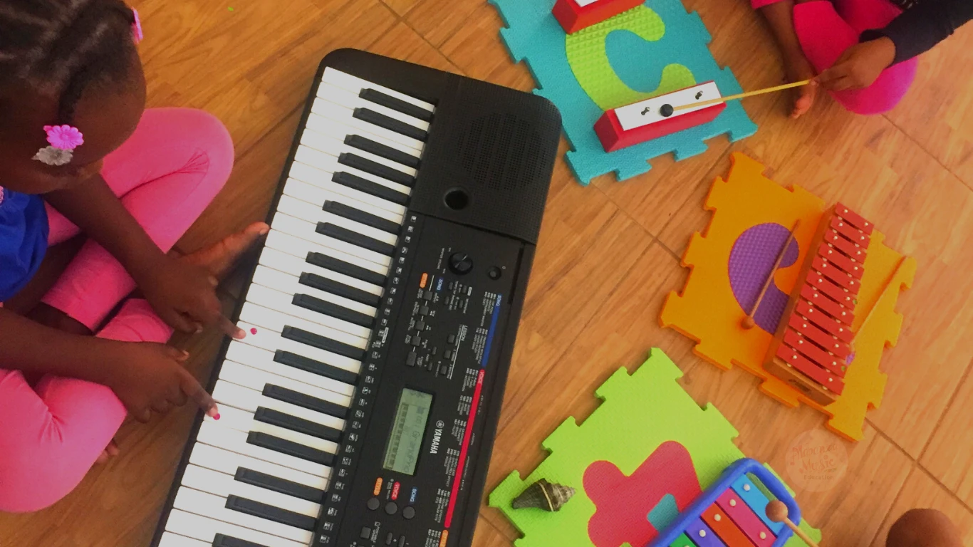 Child building early piano and voice foundations through active musical learning