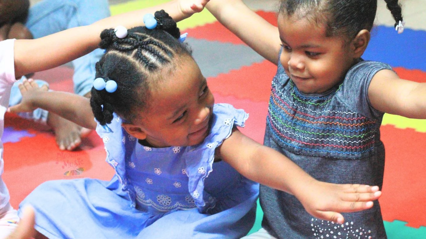 Young children making music together