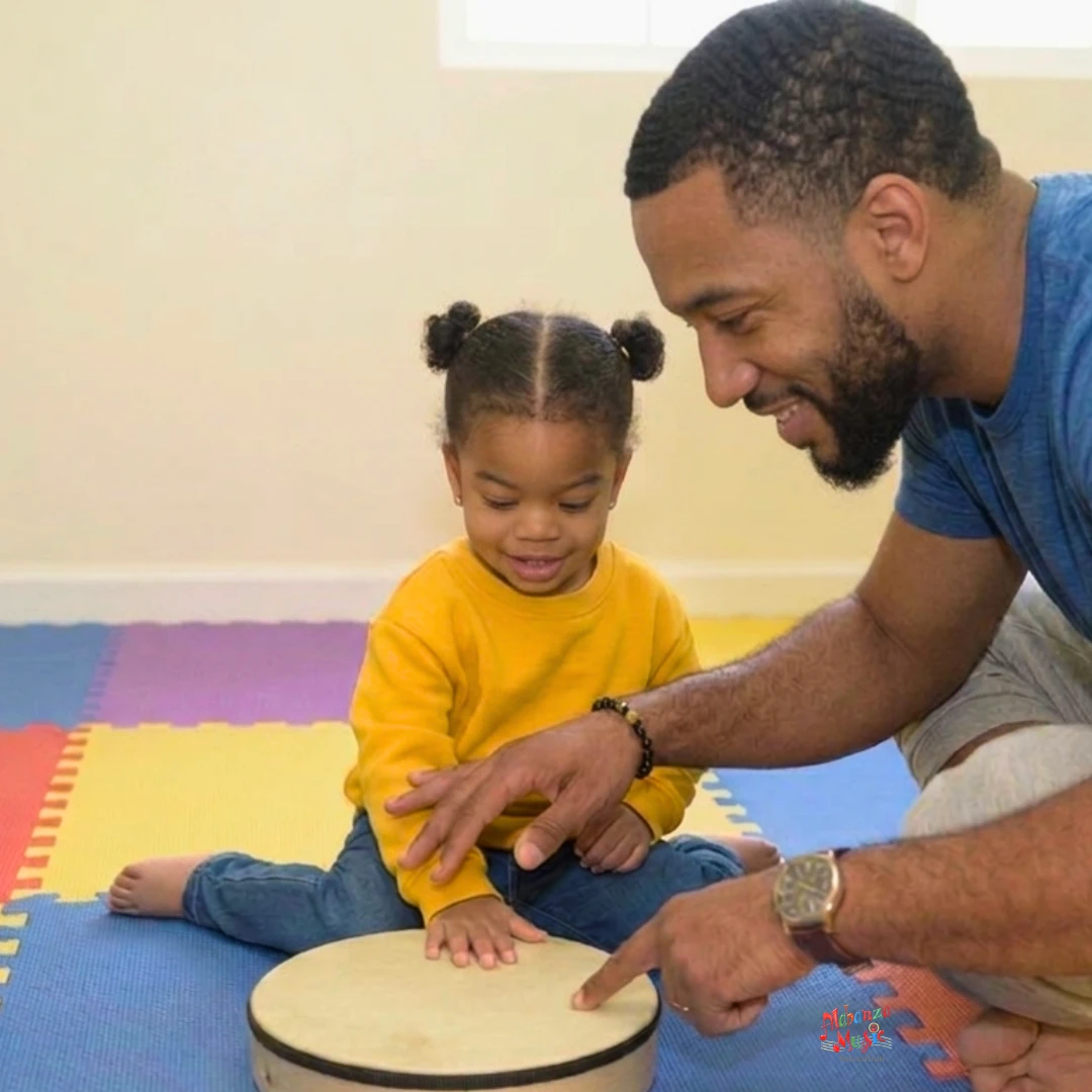 Dad and baby on drum in Bouncing Bambinos