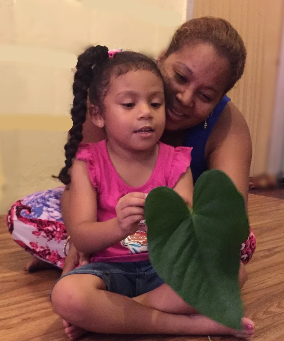 Child outdoors showing joy, curiosity and love of learning