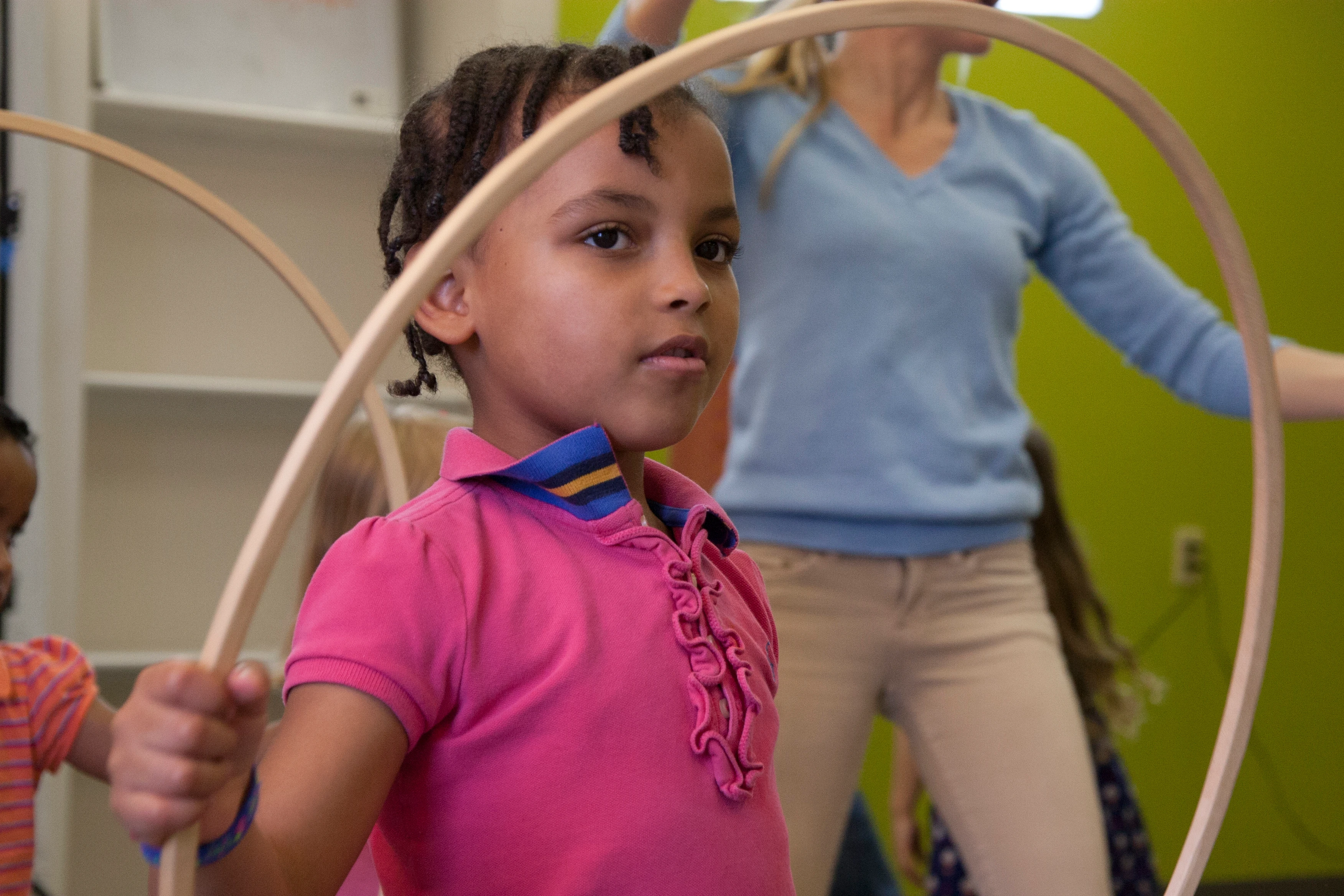 Children developing musical timing and coordination through movement