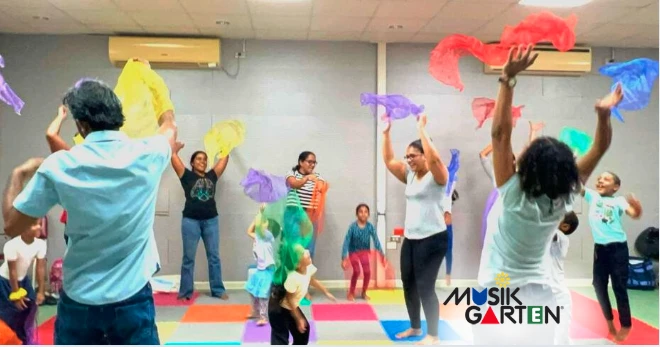 Children joyfully participating in structured music and movement learning
