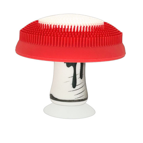 Side view of mushroom-shaped silicone scrubber showing curved cap and ergonomic grip.