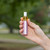 Lipstick spray in hand