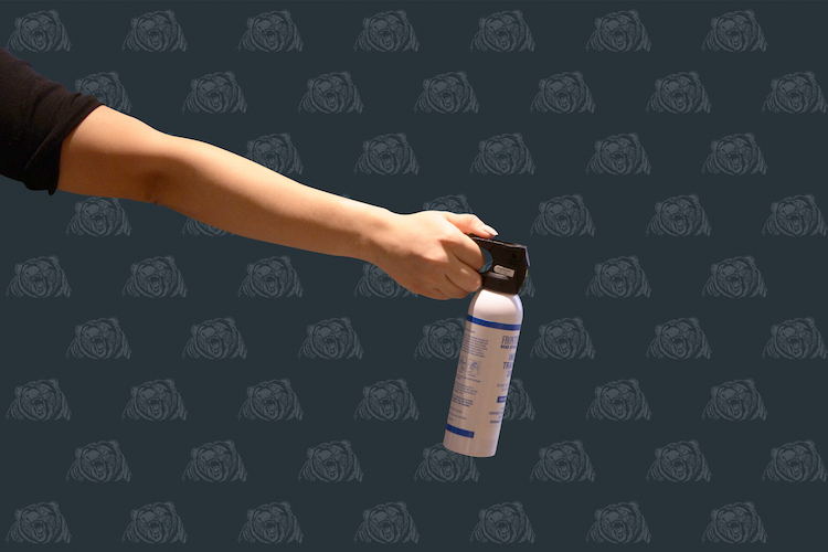 Pointing bear spray at a 45 degree angle