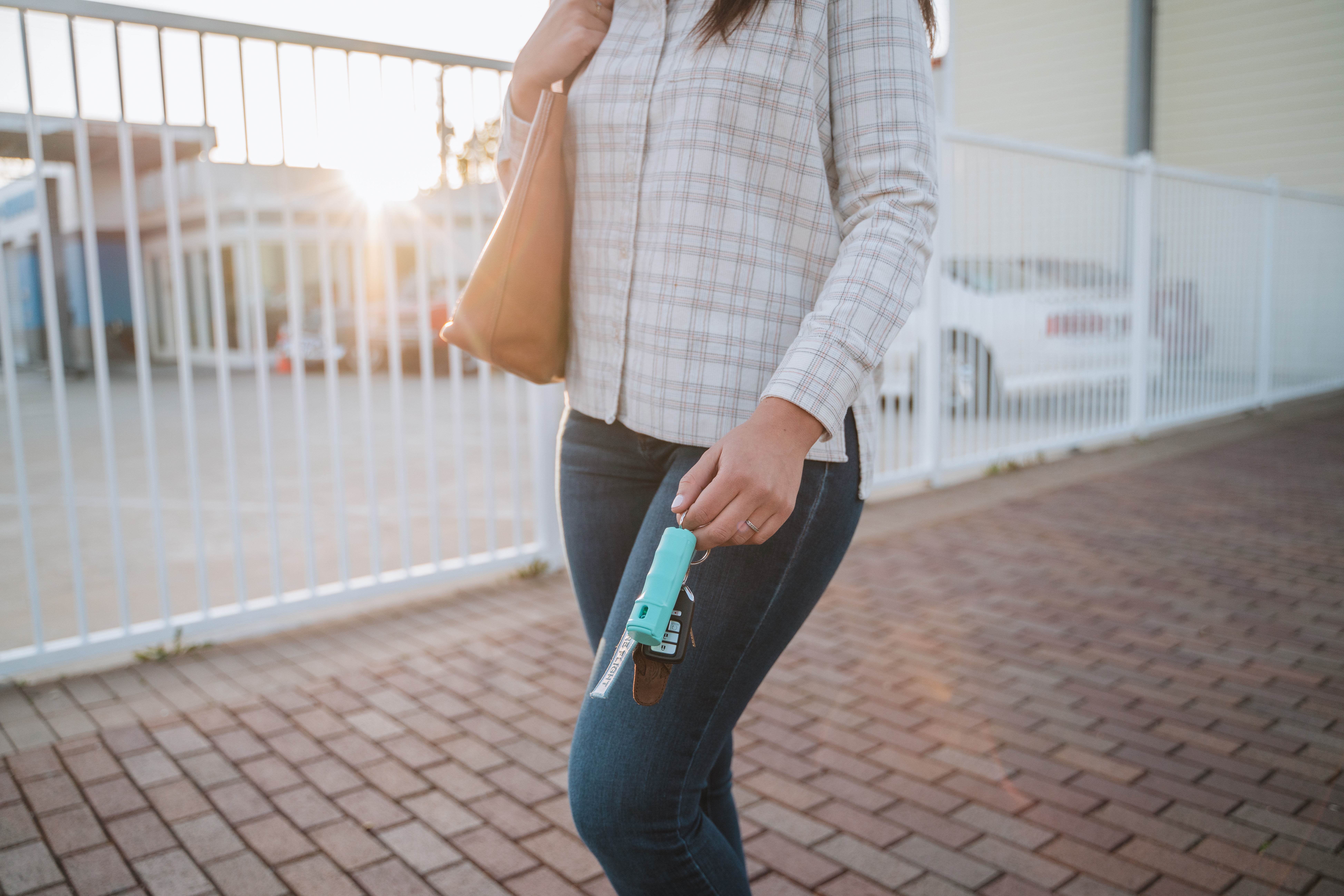 Pepper Spray with quick release key ring in city street