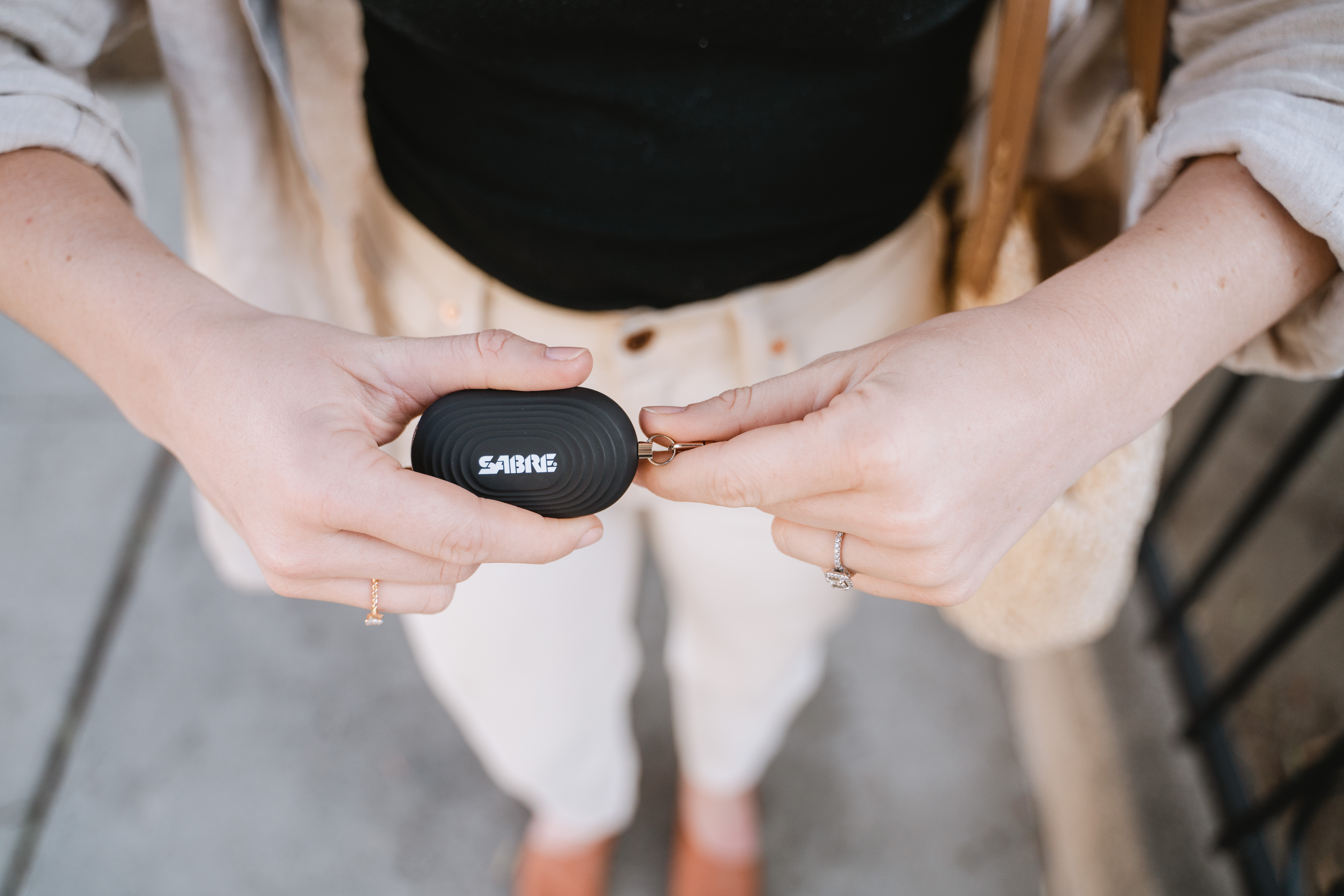 Pulling trigger on Personal Alarm to set off alarm