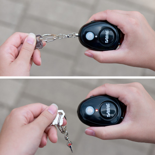 Pulling out metal keychain on a personal alarm