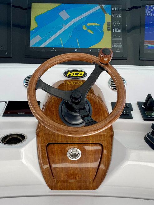 Edson teak and carbon PowerWheel displayed on an HCB center console yacht Edson teak and carbon PowerWheel displayed on an HCB center console yacht