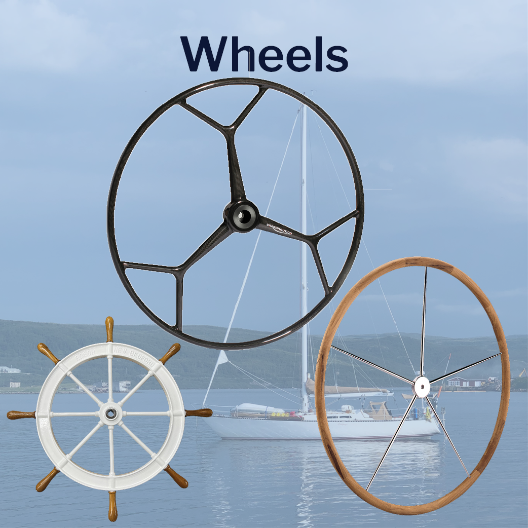 Carbon Fiber Wheel, teak rimmed destroyer wheel, character wheel, with a boat at anchor in the background. Link to Wheels Page.