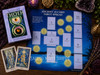 Aleister Crowley Thoth Tarot Deck Premier Edition with Ancient 10-Card Tarot Spread sheet, tarot cards, amethyst, candle, and ritual altar décor.