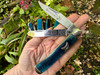 A dual-blade ritual knife with a blue horn handle is a 2-in-1 tool for the working witch. Featuring both a sharply pointed blade (spey) which is ideal for use as an athame and a more rounded blade (clip) perfect for use as a boline.
