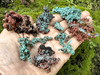 Array of native copper pieces on an open palm, front view displaying depth, raw texture, and the organic beauty of natural copper. Array of native copper pieces on an open palm, front view displaying depth, raw texture, and the organic beauty of natural copper.