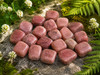 Close-up of polished Strawberry Quartz crystals highlighting their beautiful pink tones and unique natural patterns.