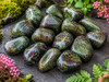 Close-up of Natural Dragon's Blood Jasper crystals highlighting their distinctive green and crimson markings.
