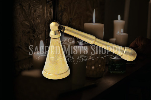 A close up of one long belled brass candle snuffer showing the bell in more detail.