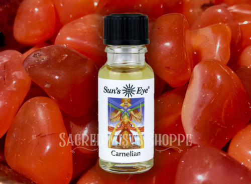 One bottle of carnelian gemstone ritual oil with carnelian crystals in the background. Perfect for creativity, passion, vitality, action.