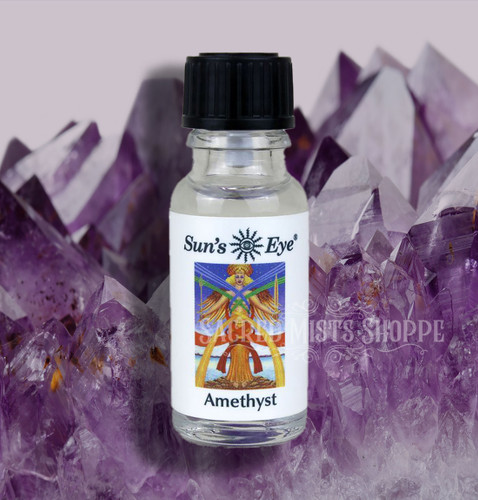 One bottle of amethyst gemstone ritual oil with crystals in the background. Perfect for spirituality, balancing, crown chakra.