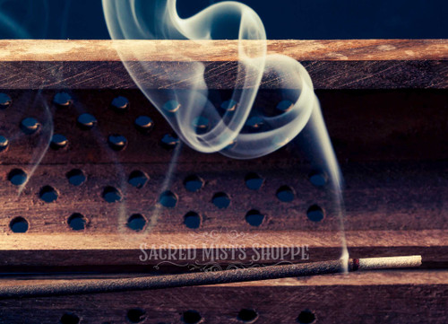Special Temple Blend Hand-Rolled Masala Incense close-up burning in a coffin burner.