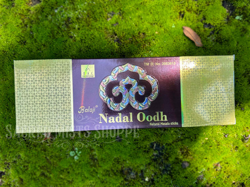 Beautiful box of Nadal Oudh Premium Masala Hand-Rolled Incense Sticks. Infused with the richness of authentic Oodh (aloeswood) and the serenity of sandalwood, these incense sticks transport you to a realm of tranquility and spirituality.