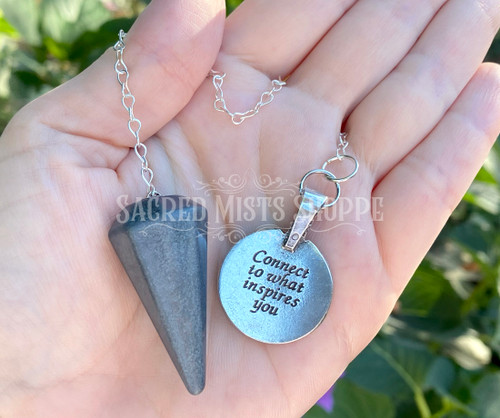 Gorgeous polished crystal pendulums with incredibly striking pendants come together to create amazing magick. The pendants, with their powerful inscriptions on the back, are sure to be a beautiful addition to your pendulum divination arsenal, especially if you love the Elemental Night.

A pendulum is a simple and easy tool used for both divination and dousing. It is an aid for communicating with the subconscious mind and the subtle energy fields surrounding people, plants, animals, and objects. It can be used to answer simple yes/no/maybe questions or with a spirit board or other grid for more advanced practitioners.