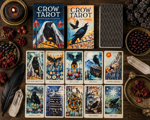 Crow tarot shown from above with several cards displayed along with the guidebook surrou