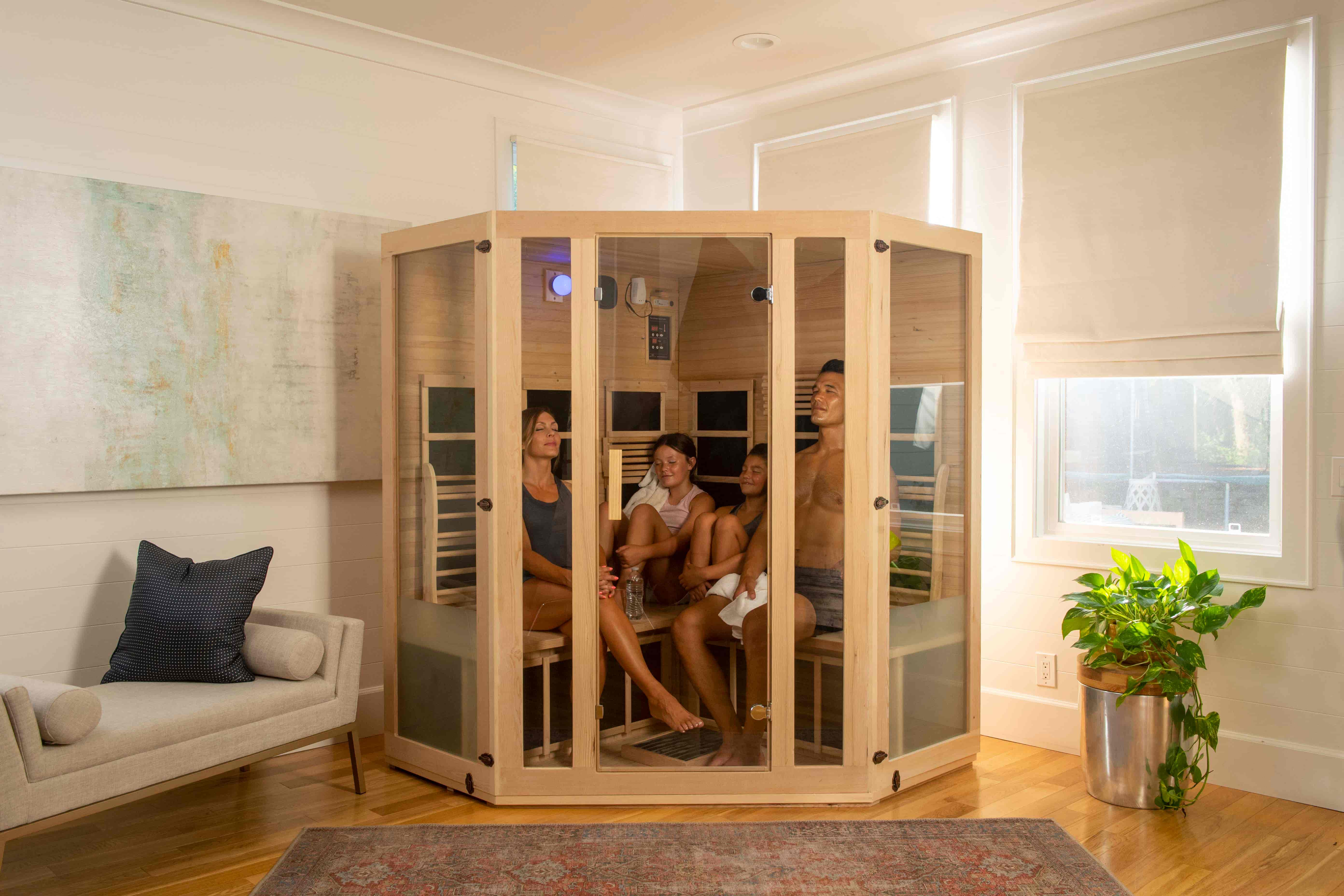 Family Enjoying An Infrared Sauna Session Together Inside Of A Jnh Lifestyles Sauna 