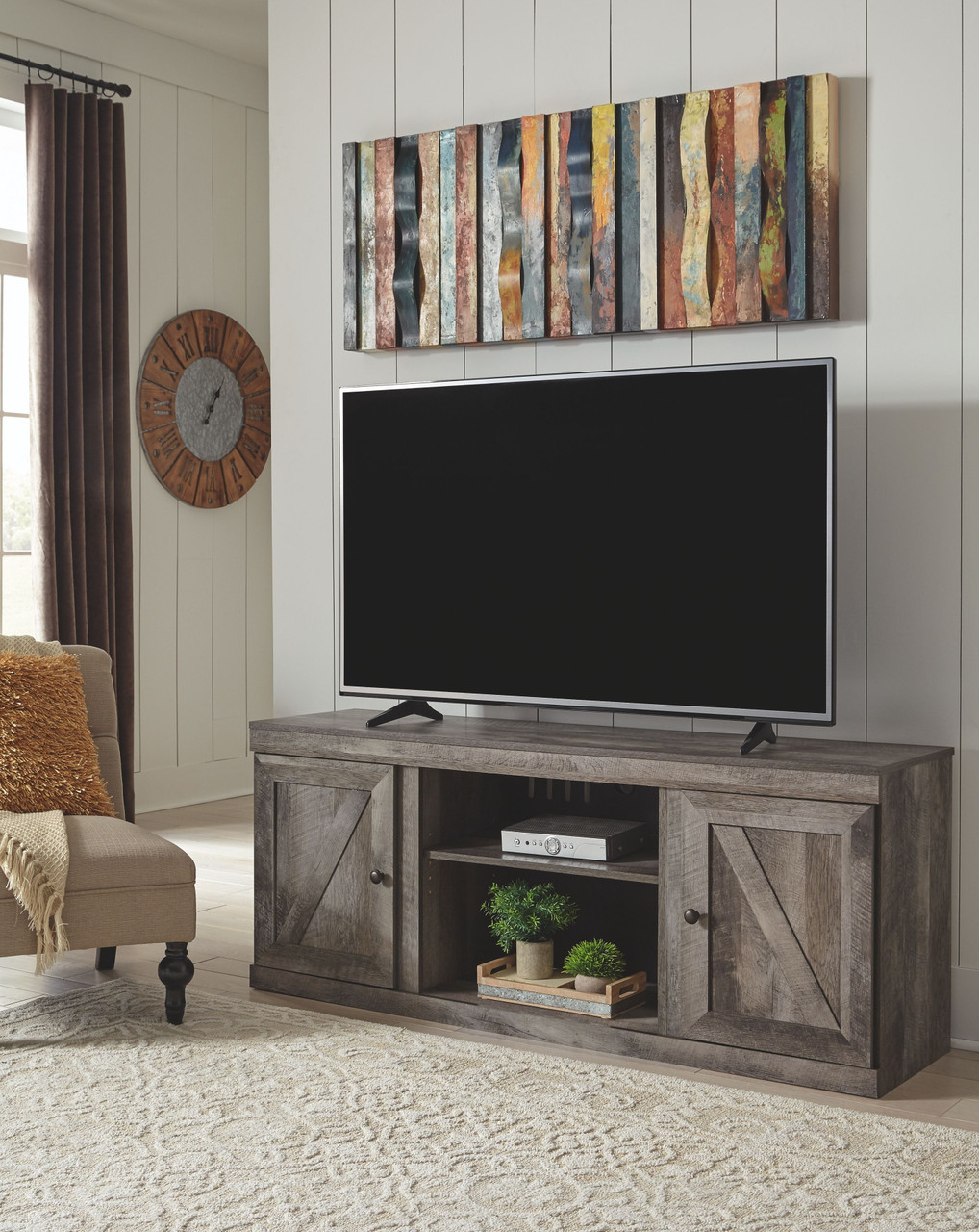 The Wynnlow Gray Lg TV Stand W/fireplace Option sold at Hilton