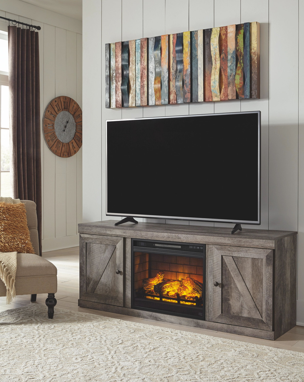 The Wynnlow Gray Lg TV Stand W/fireplace Option sold at Hilton