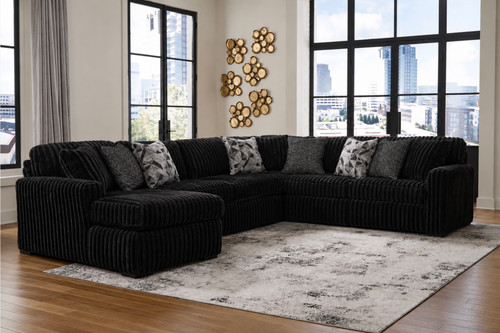 Onyx 4 pc Sectional with Pillows: Sectional $2399.99 Ottoman $319.99