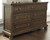 Flynnter Medium Brown 6 Pc. Dresser, Mirror, Chest & California King Panel Bed with Storage
