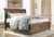 Flynnter Medium Brown Queen Sleigh Storage Bed