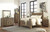 Trinell Brown 8 Pc. Dresser with Fireplace Option, Mirror, Chest, King Poster Bed & Nightstand