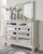 Lindenfield Champagne 7 Pc. Dresser, Mirror, King Panel Bed, 2 Nightstands